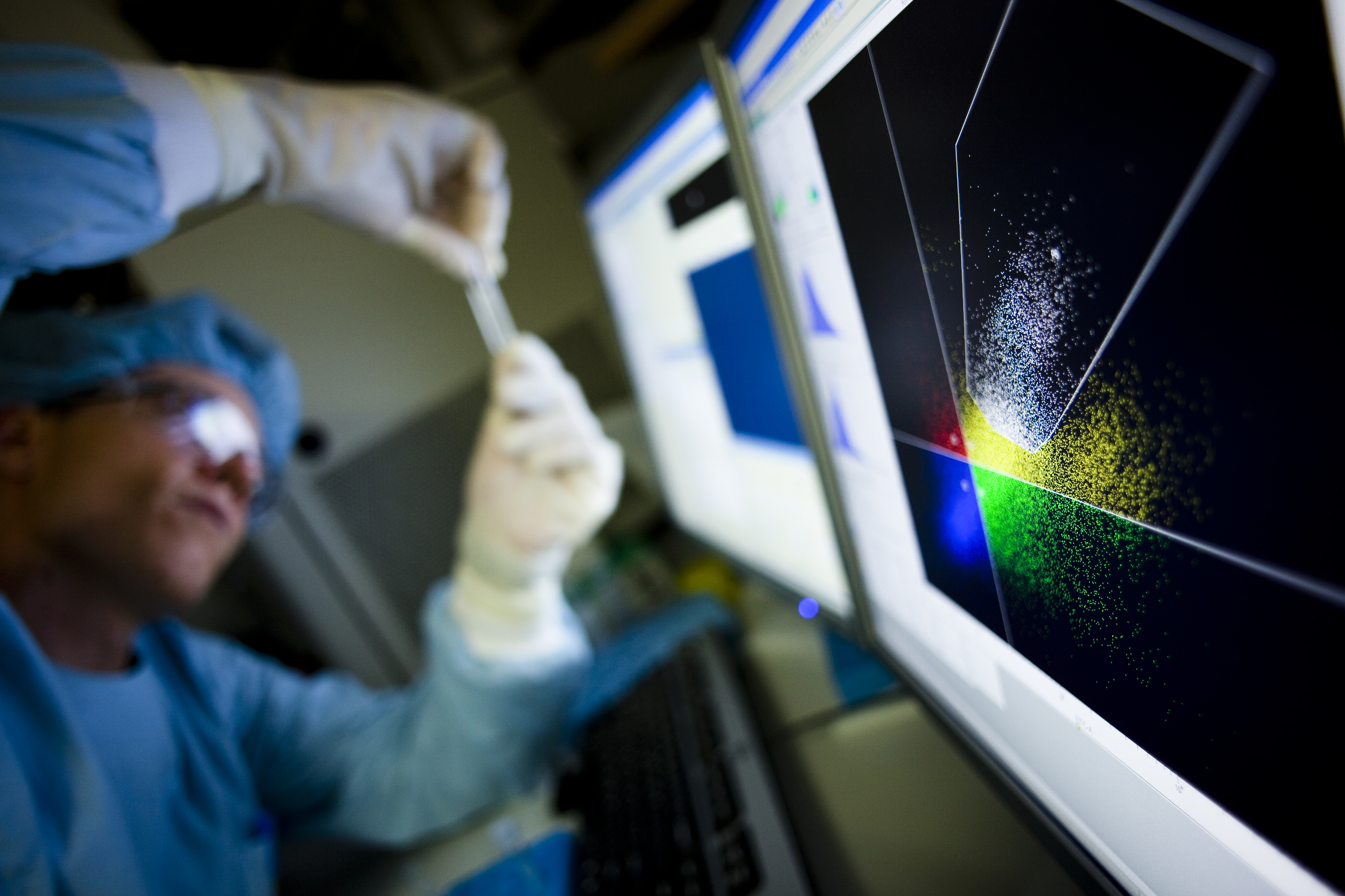 Researcher at a flow-cytometry analysis screen